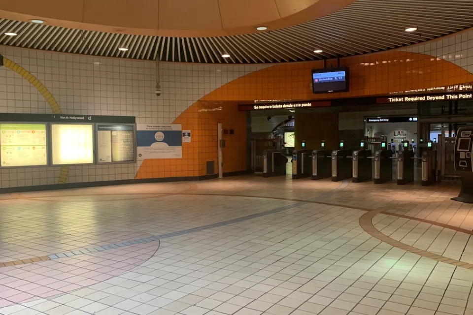 Empty corridor at North Hollywood Metro station with orange and white tiles in North Hollywood, California.